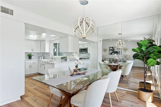 a view of kitchen and dining room with wooden floor
