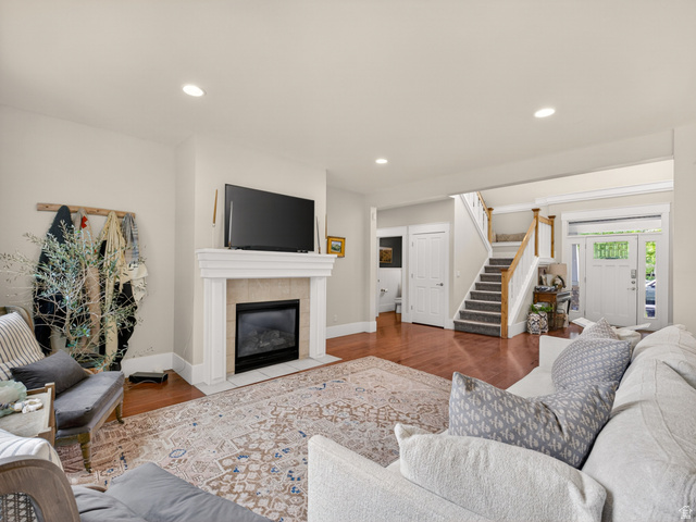 557 Craftsman Way Midway, UT 84049 - Photo 12 of 59 Living area featuring a fireplace with a mantel, recessed lighting, and wood-finish flooring