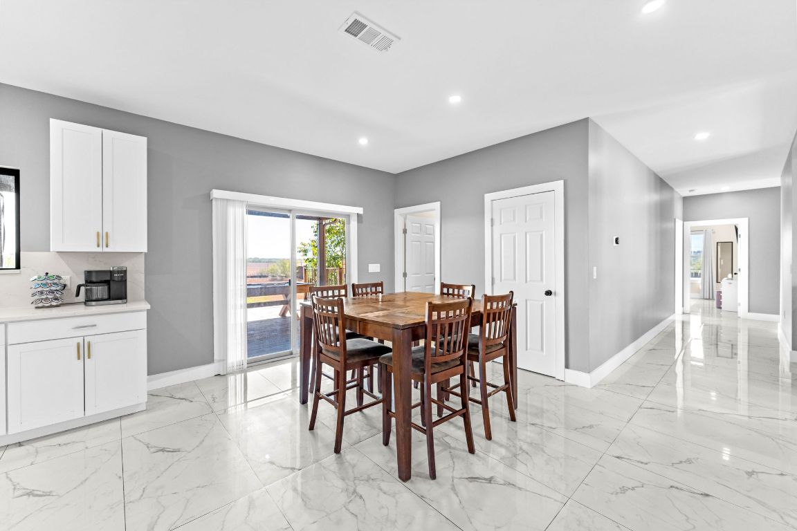 749 El Rey Drive Kyle, TX 78640 - Photo 12 of 40 a view of a dining area with furniture