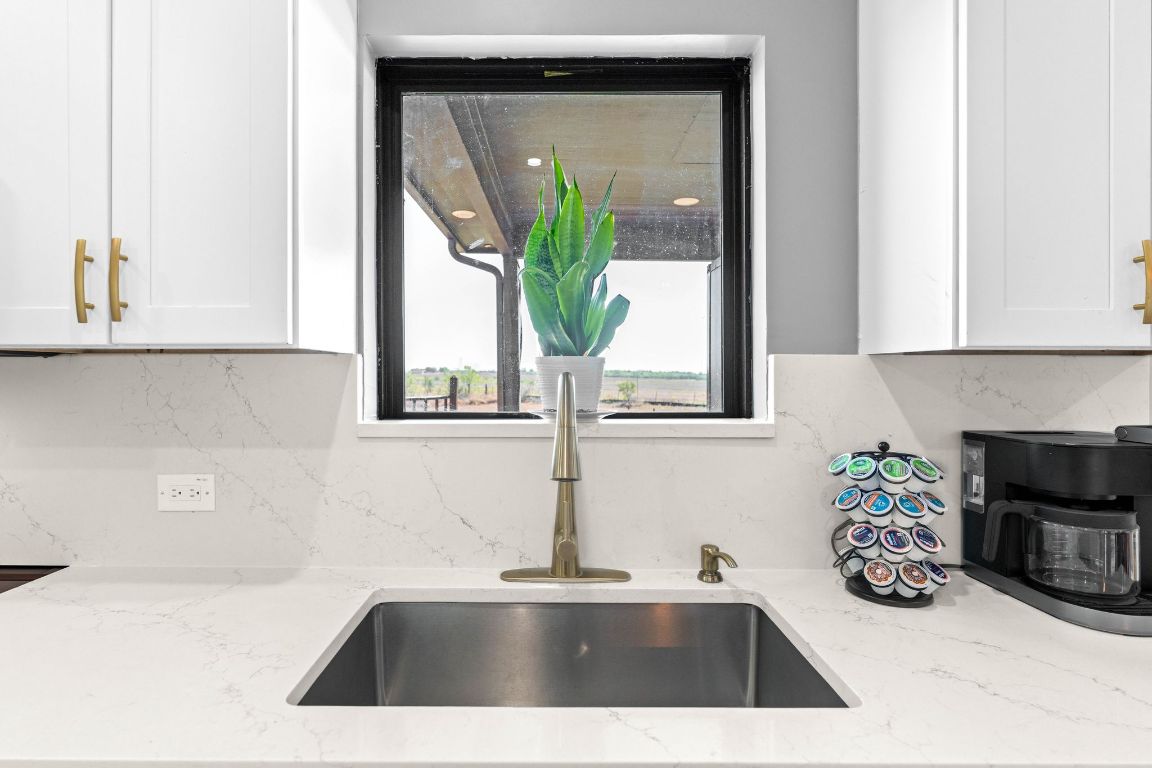 749 El Rey Drive Kyle, TX 78640 - Photo 16 of 40 a bathroom with a sink and a mirror