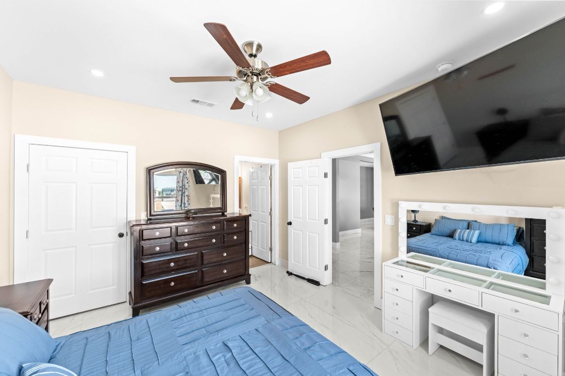 749 El Rey Drive Kyle, TX 78640 - Photo 20 of 40 a living room with furniture and a flat screen tv