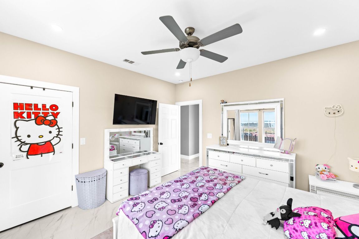 749 El Rey Drive Kyle, TX 78640 - Photo 24 of 40 a very nice looking living room with a flat screen tv