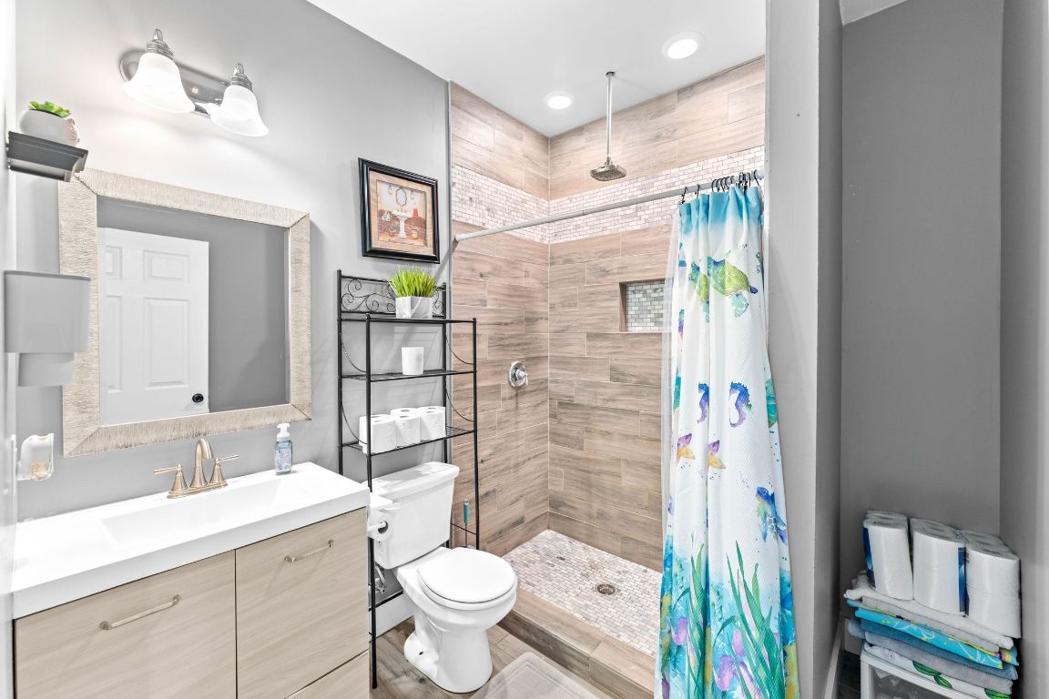 749 El Rey Drive Kyle, TX 78640 - Photo 26 of 40 a bathroom with a sink toilet and shower