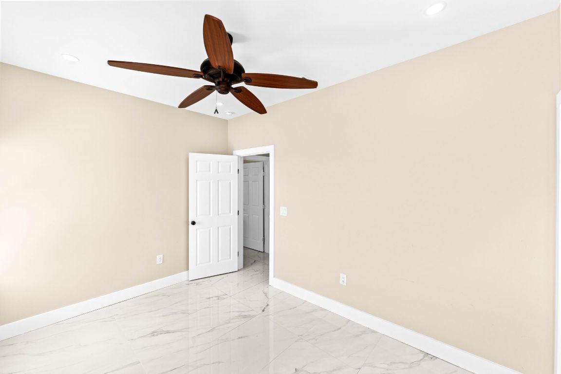 749 El Rey Drive Kyle, TX 78640 - Photo 30 of 40 a view of a ceiling fan in a bathroom