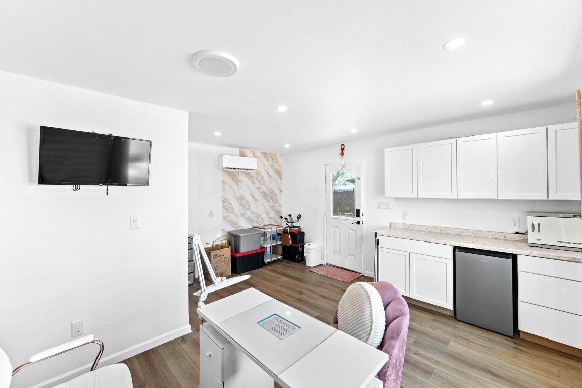 749 El Rey Drive Kyle, TX 78640 - Photo 32 of 40 a living room with furniture and a flat screen tv