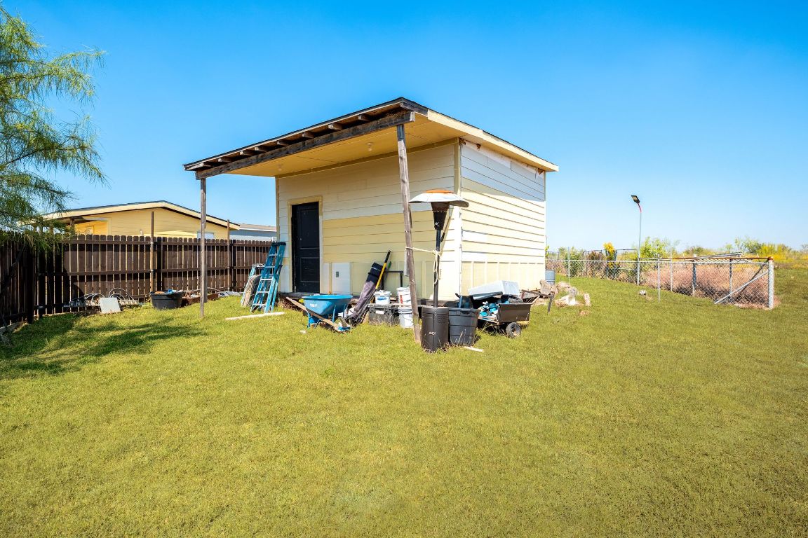749 El Rey Drive Kyle, TX 78640 - Photo 39 of 40 a view of a house with swimming pool and sitting area
