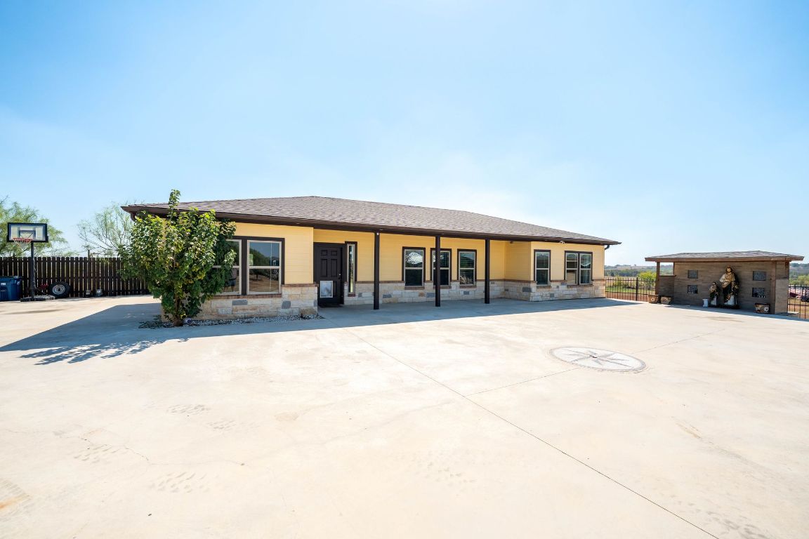749 El Rey Drive Kyle, TX 78640 - Photo 4 of 40 a outdoor space view with a garden and view of house