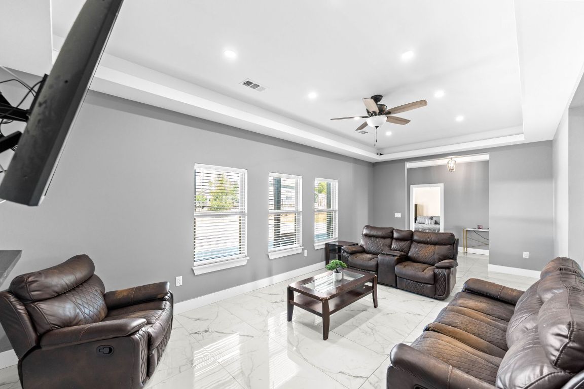 749 El Rey Drive Kyle, TX 78640 - Photo 9 of 40 a living room with furniture ceiling fan and a window