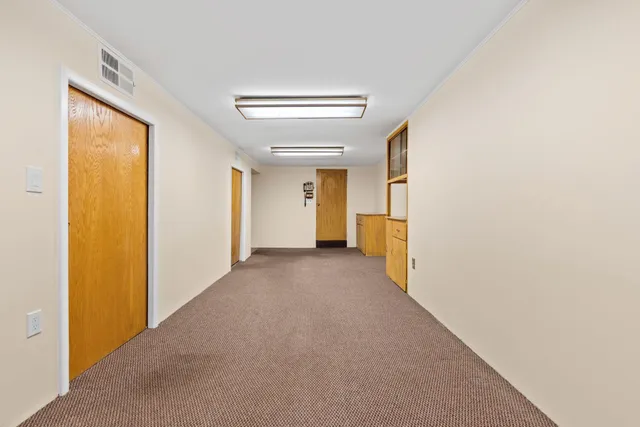 a view of a hallway with closet