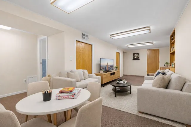 a living room with furniture and a table