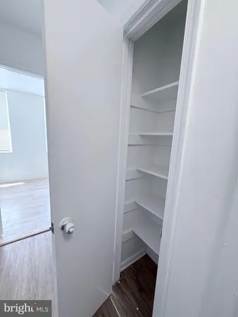 a view of an empty walk in closet