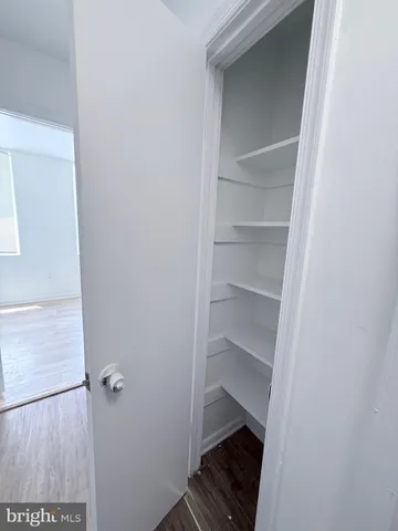 a view of an empty walk in closet