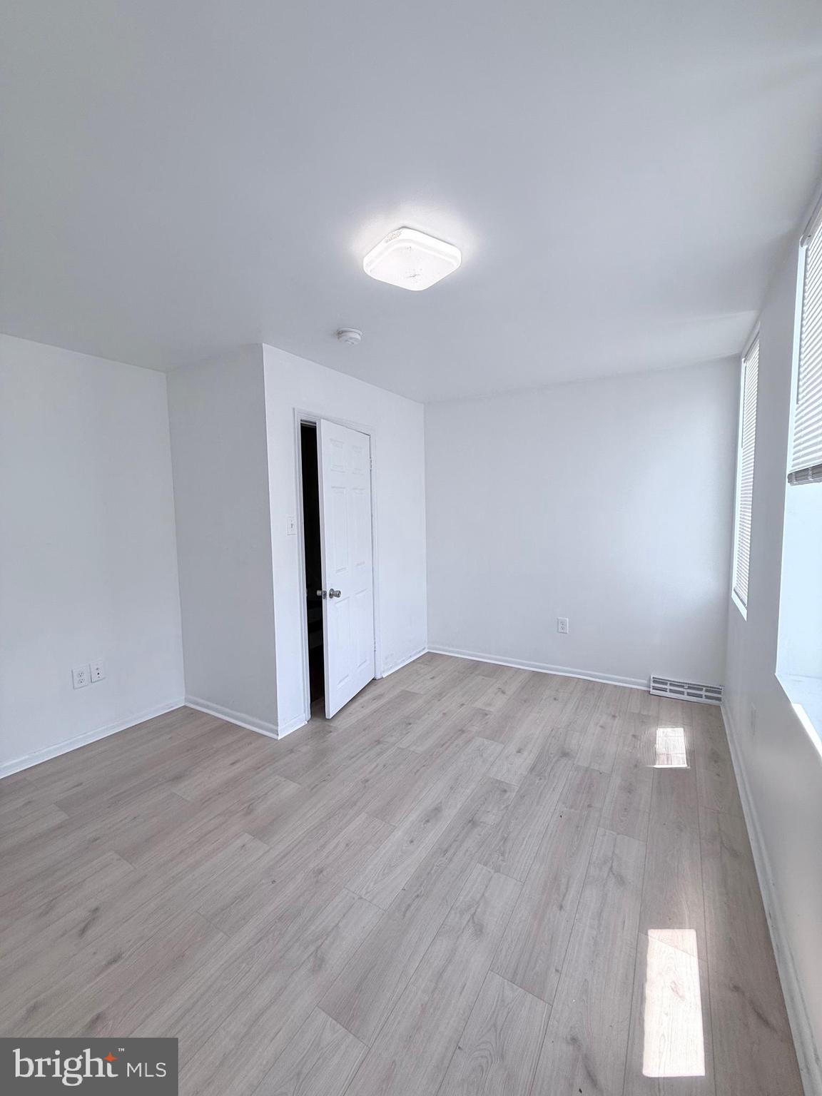 1820 West Fayette Street, Unit 2 Baltimore, MD 21223 - Photo 13 of 26 a view of an empty room and window