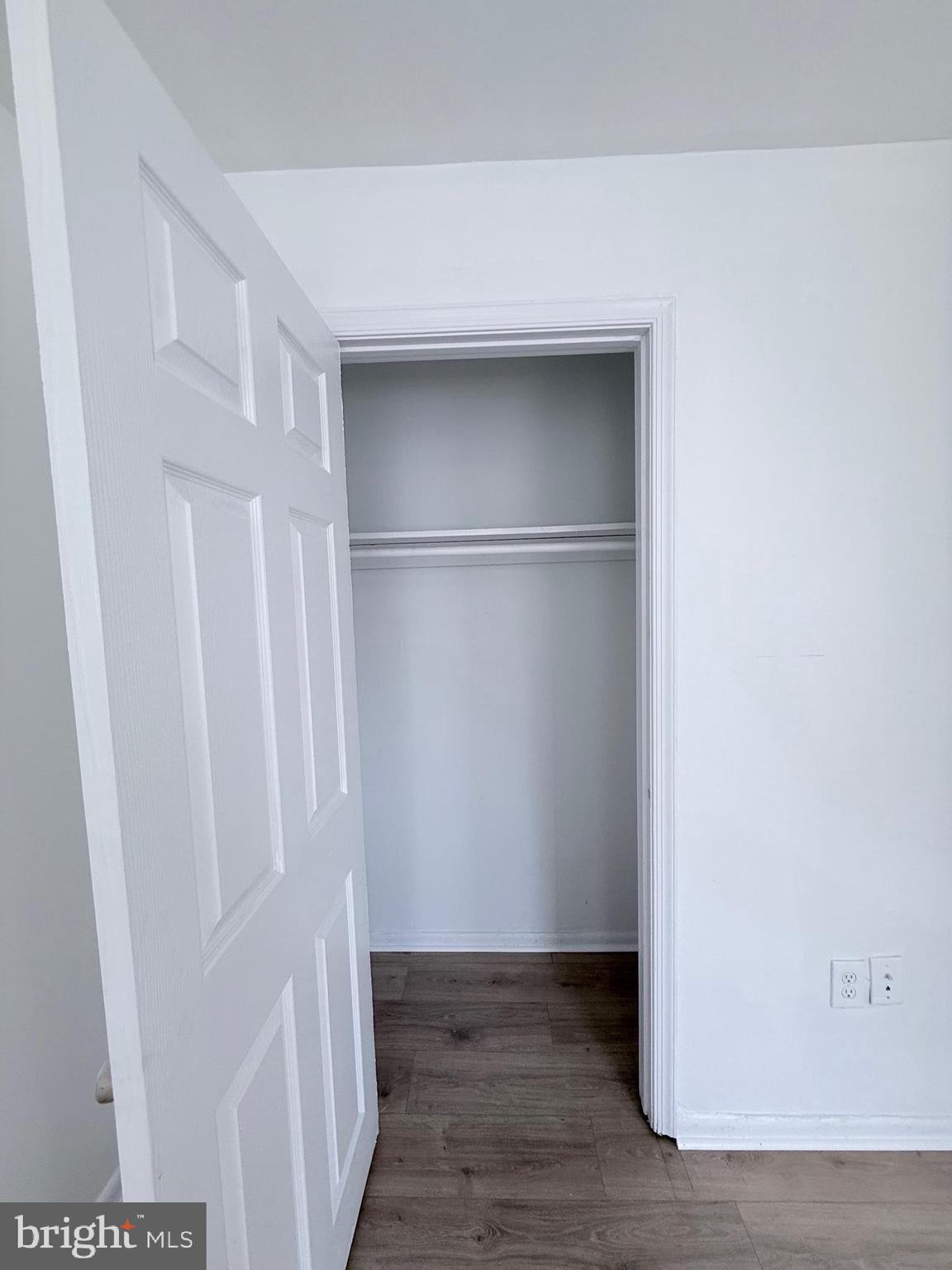 1820 West Fayette Street, Unit 2 Baltimore, MD 21223 - Photo 14 of 26 a view of walk in closet with wooden floor