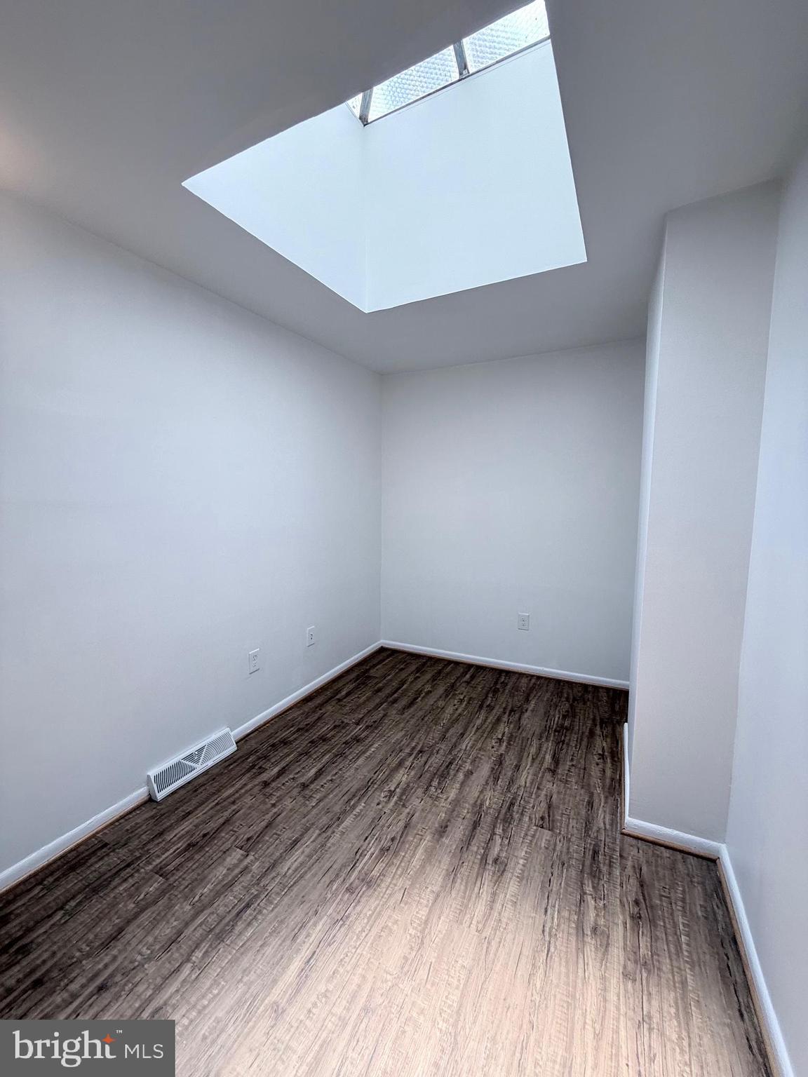 1820 West Fayette Street, Unit 2 Baltimore, MD 21223 - Photo 19 of 26 a view of an empty room and wooden floor