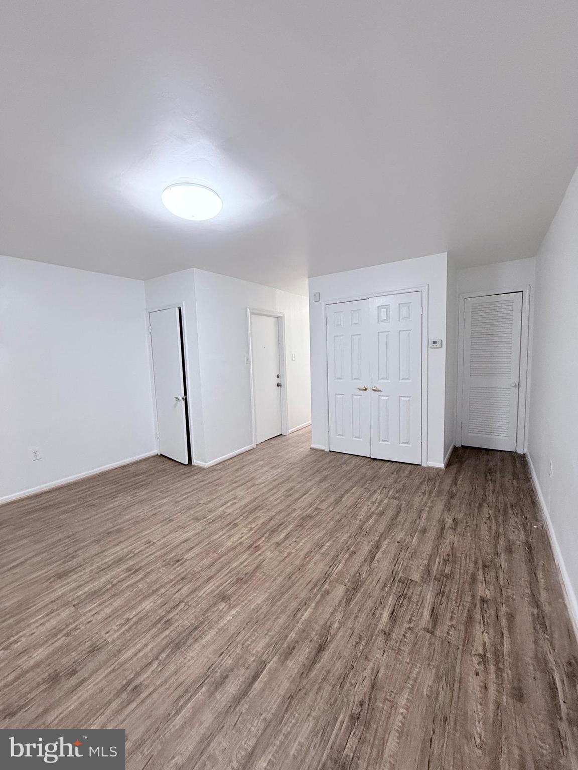1820 West Fayette Street, Unit 2 Baltimore, MD 21223 - Photo 4 of 26 a view of empty room with wooden floor