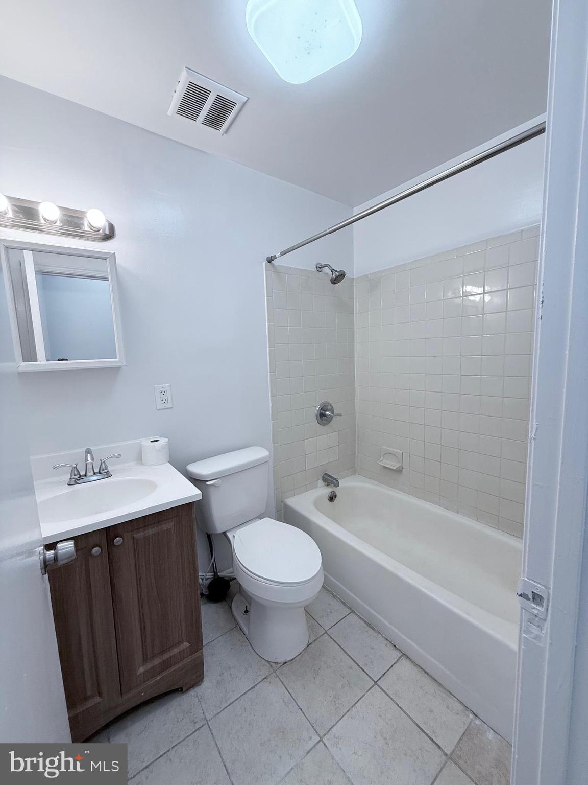 1820 West Fayette Street, Unit 2 Baltimore, MD 21223 - Photo 10 of 26 a bathroom with a sink toilet and shower