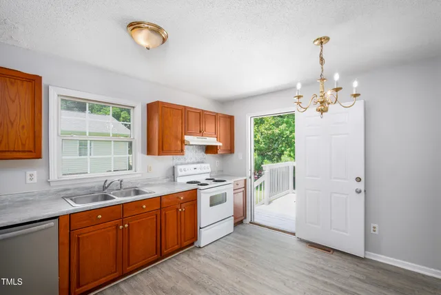 a kitchen with sink cabinets and window