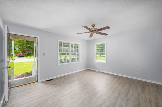 a view of an empty room with a window