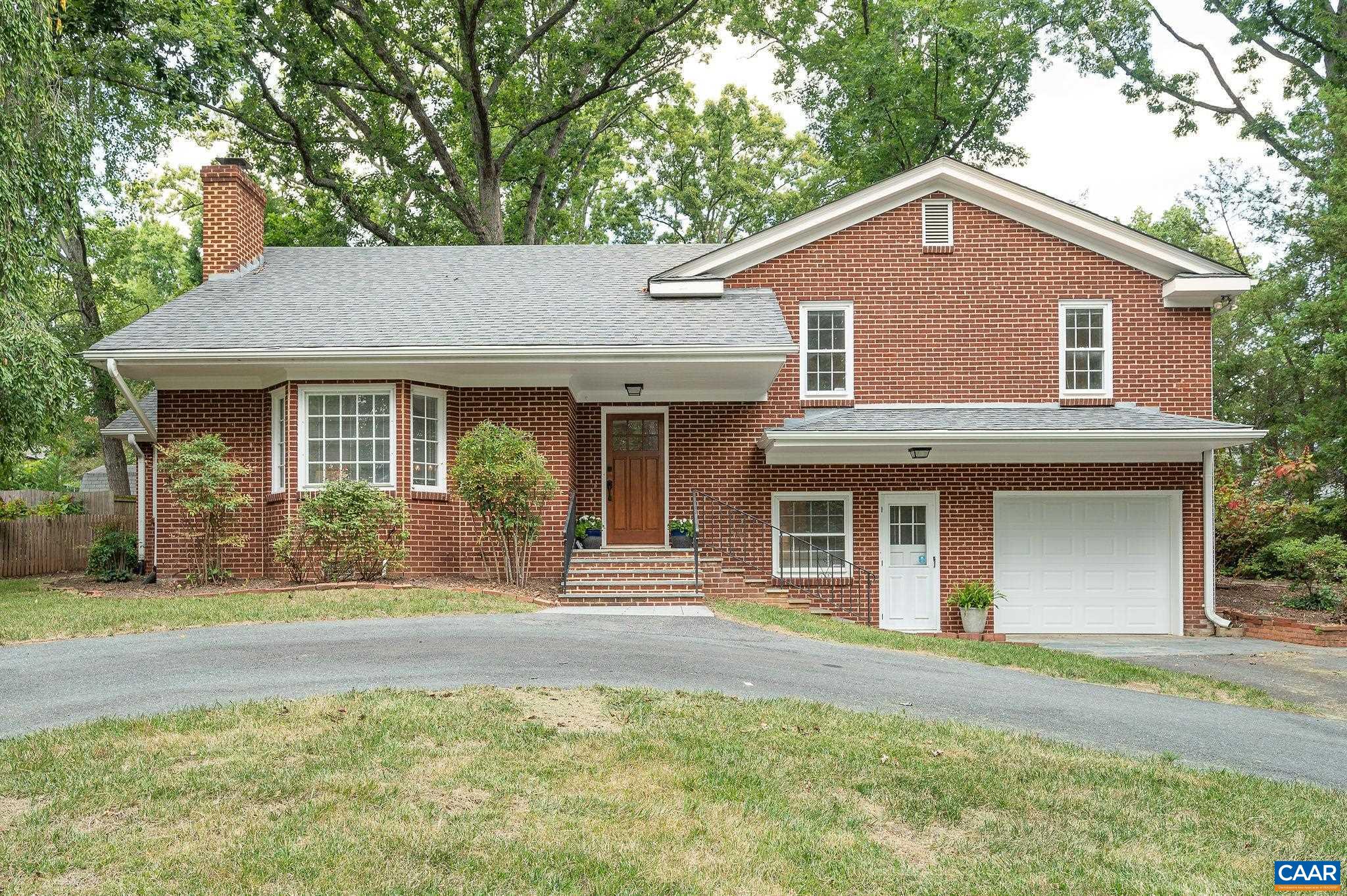 2025 Thomson Road Charlottesville, VA 22903 - Photo 1 of 37 a front view of a house with a yard
