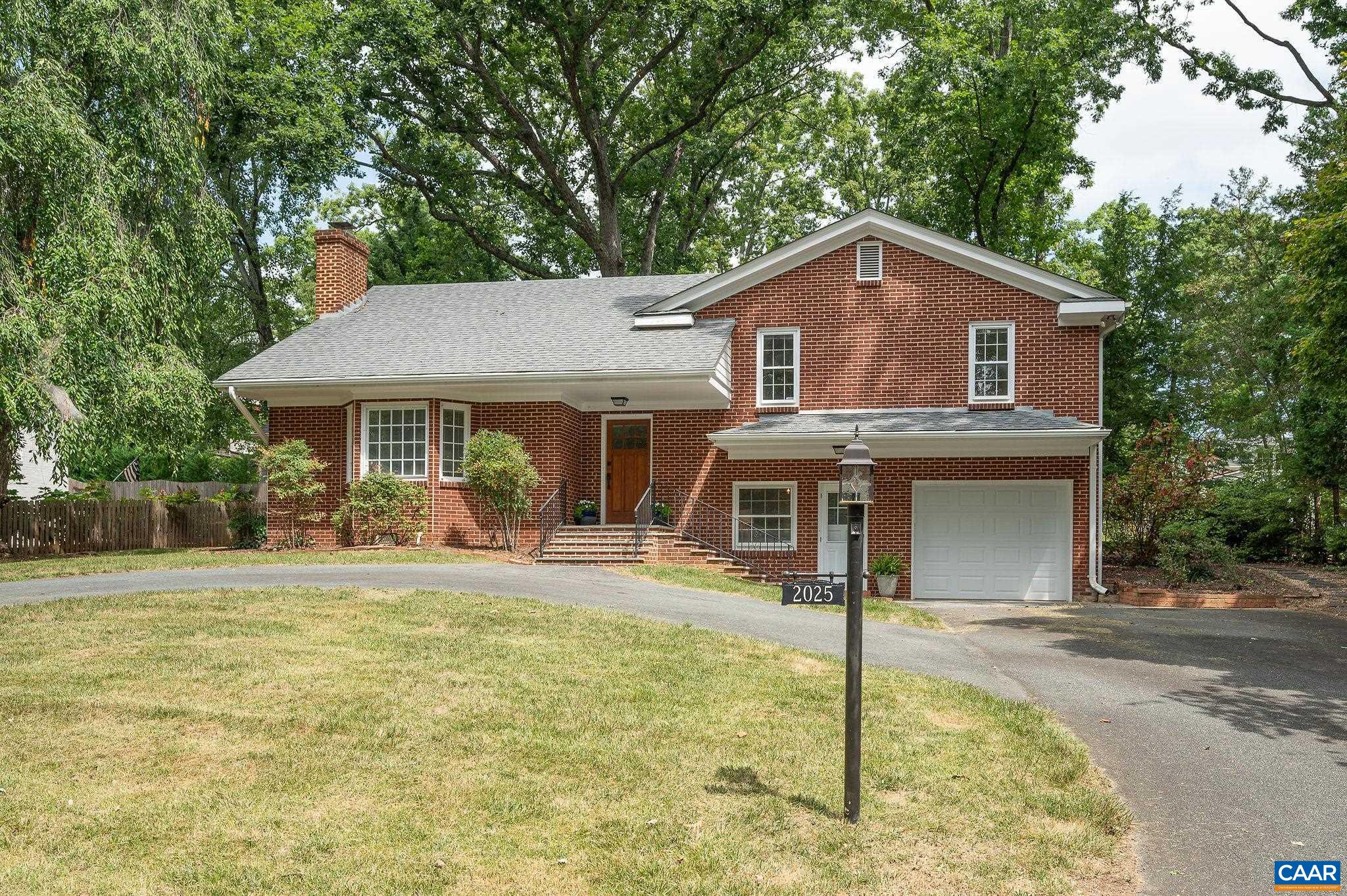 2025 Thomson Road Charlottesville, VA 22903 - Photo 2 of 37 a front view of a house with garden
