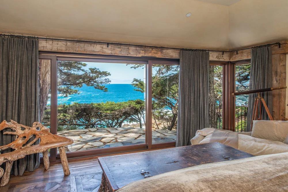 157-163 Spindrift Road Carmel, CA 93923 - Photo 36 of 100 a living room with couch and a floor to ceiling window