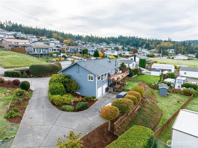 a view of a lake with a house swimming pool and outdoor space