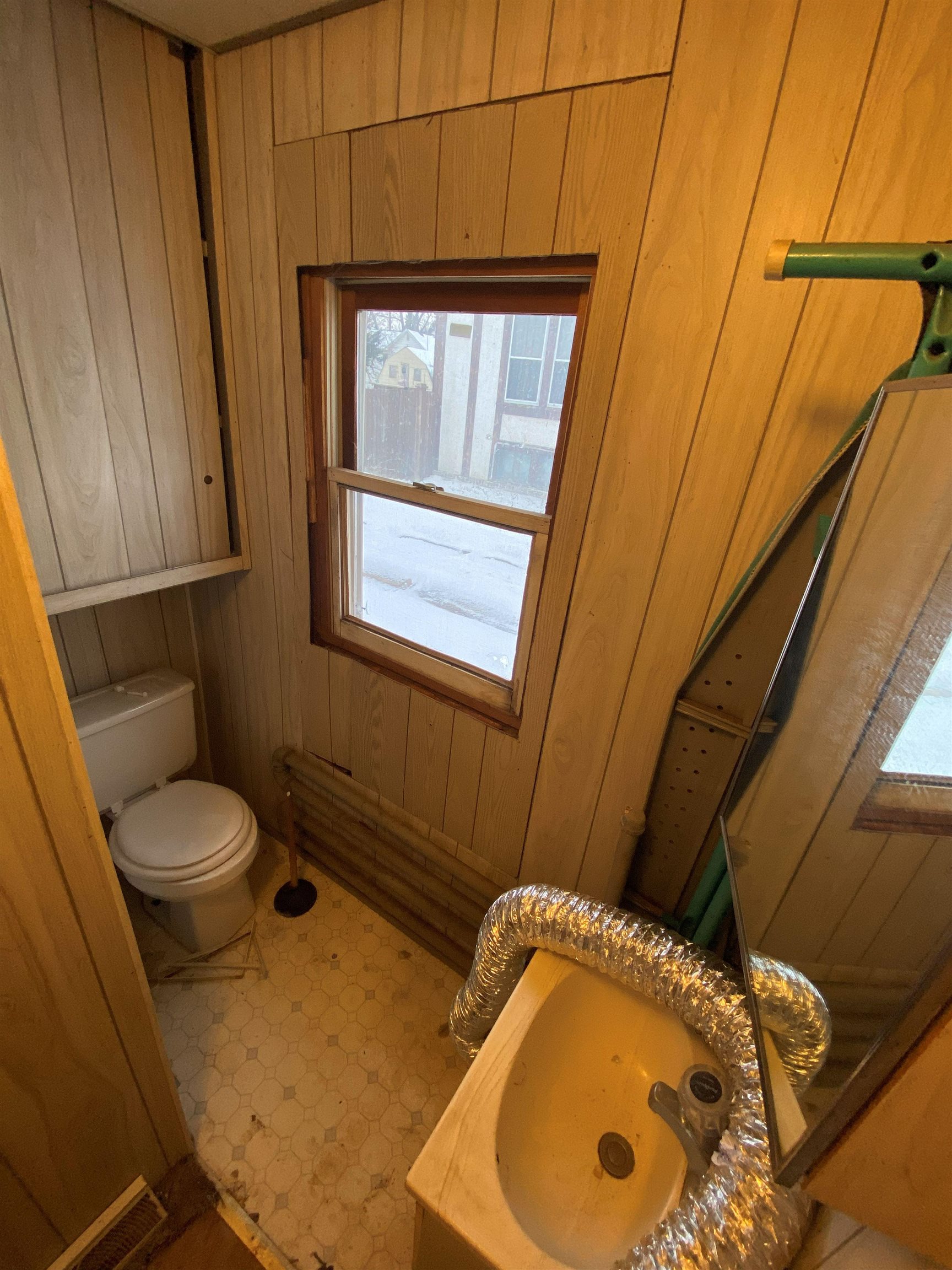 609 West Pleasant Street Freeport, IL 61032 - Photo 6 of 17 a bathroom with a granite countertop sink and a mirror