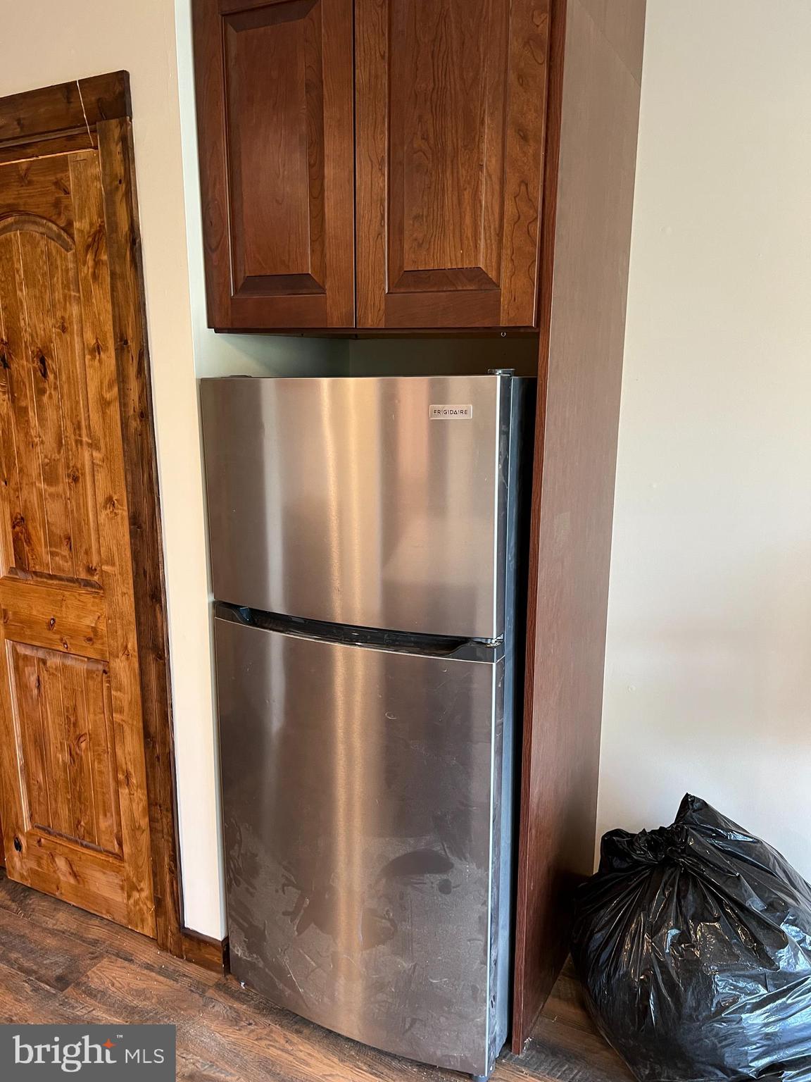 140 The Hill Road, Unit 21B Basye, VA 22810 - Photo 8 of 17 a refrigerator freezer sitting inside of a kitchen
