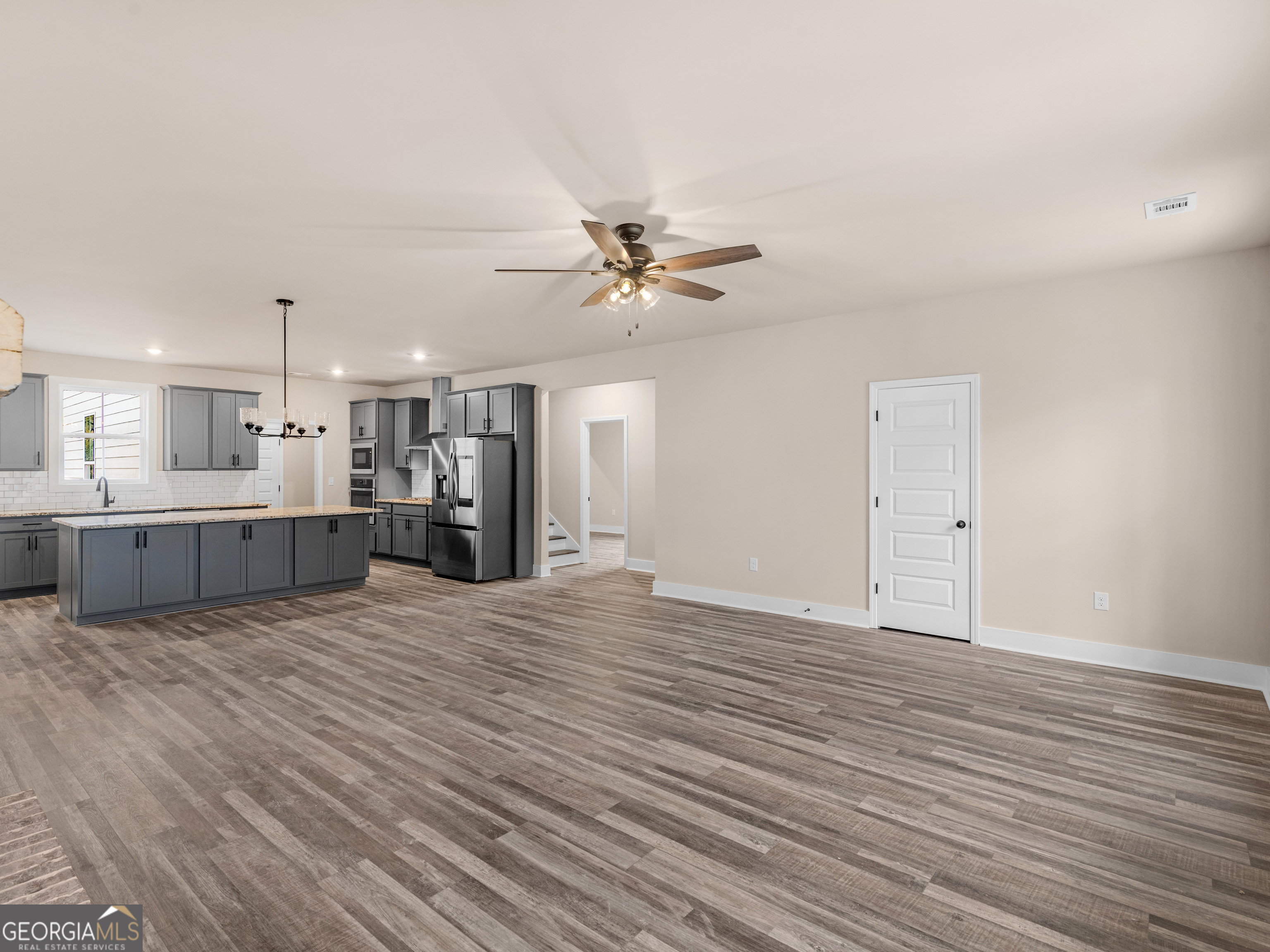 160 Loyd Road Mansfield, GA 30056 - Photo 14 of 53 a view of an empty room with a kitchen