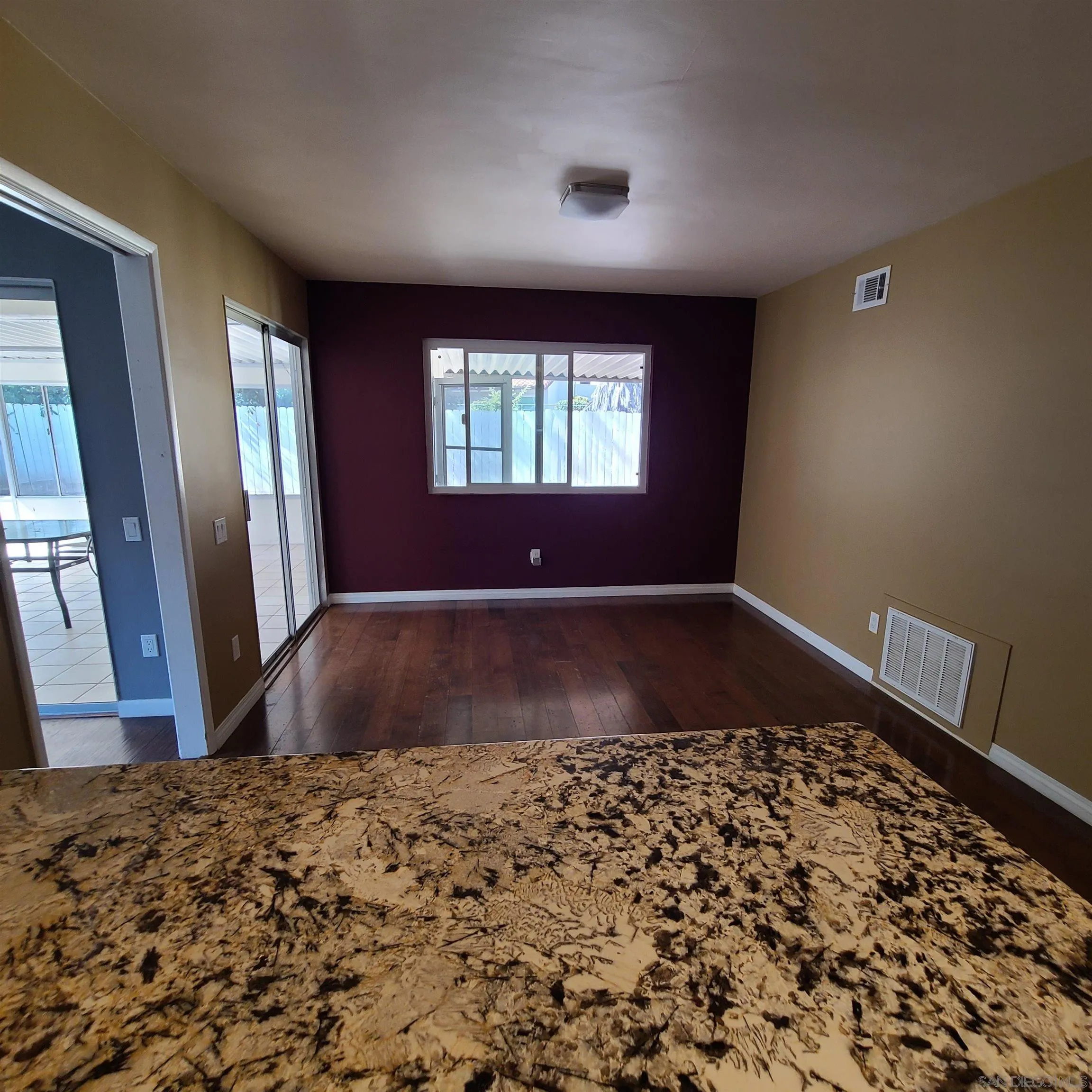 12731 Rios Road San Diego, CA 92128 - Photo 20 of 46 a view of a bedroom with wooden floor and a window
