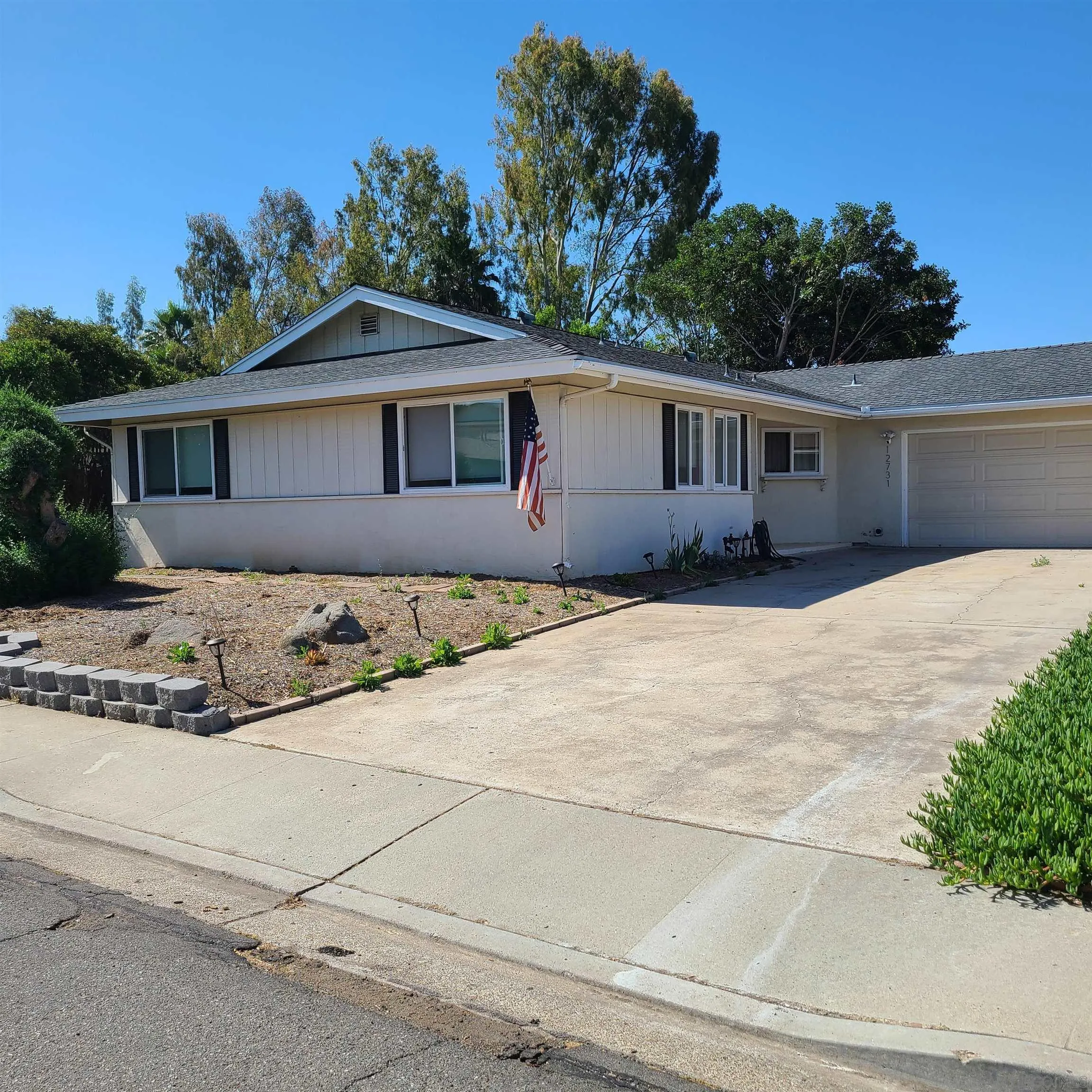 12731 Rios Road San Diego, CA 92128 - Photo 2 of 46 a front view of a house with a yard
