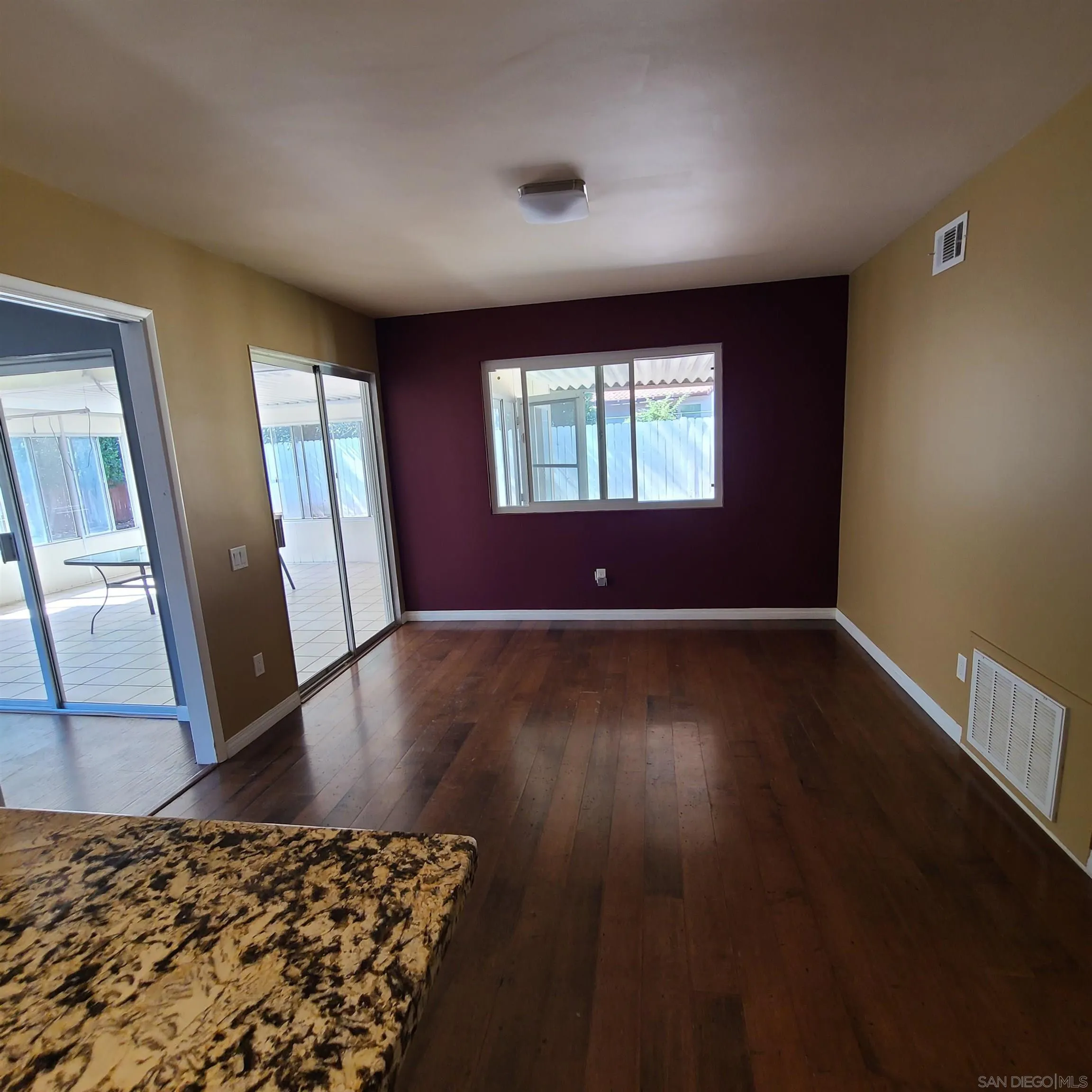 12731 Rios Road San Diego, CA 92128 - Photo 21 of 46 wooden floor in an empty room with a window
