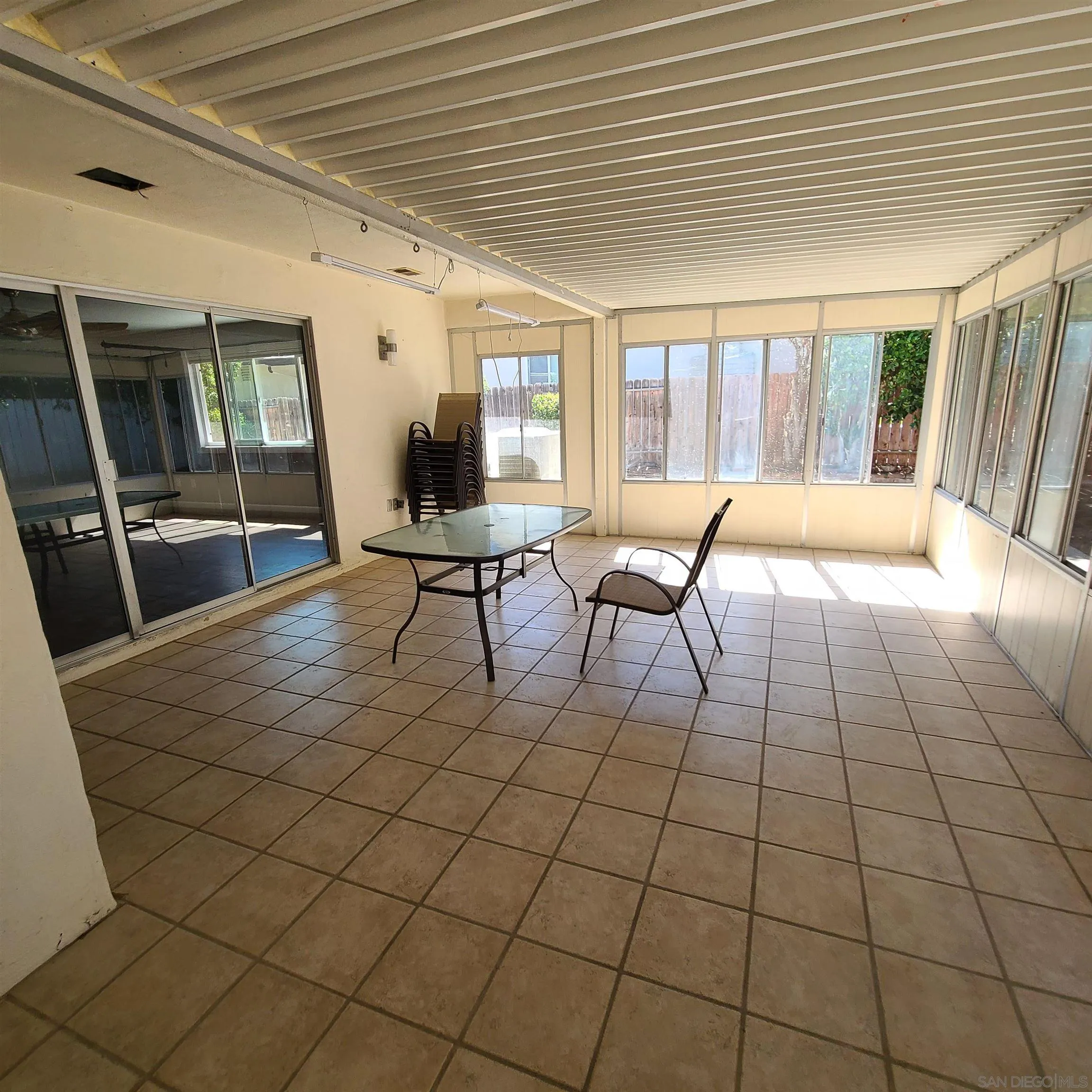 12731 Rios Road San Diego, CA 92128 - Photo 23 of 46 a living room with a large window