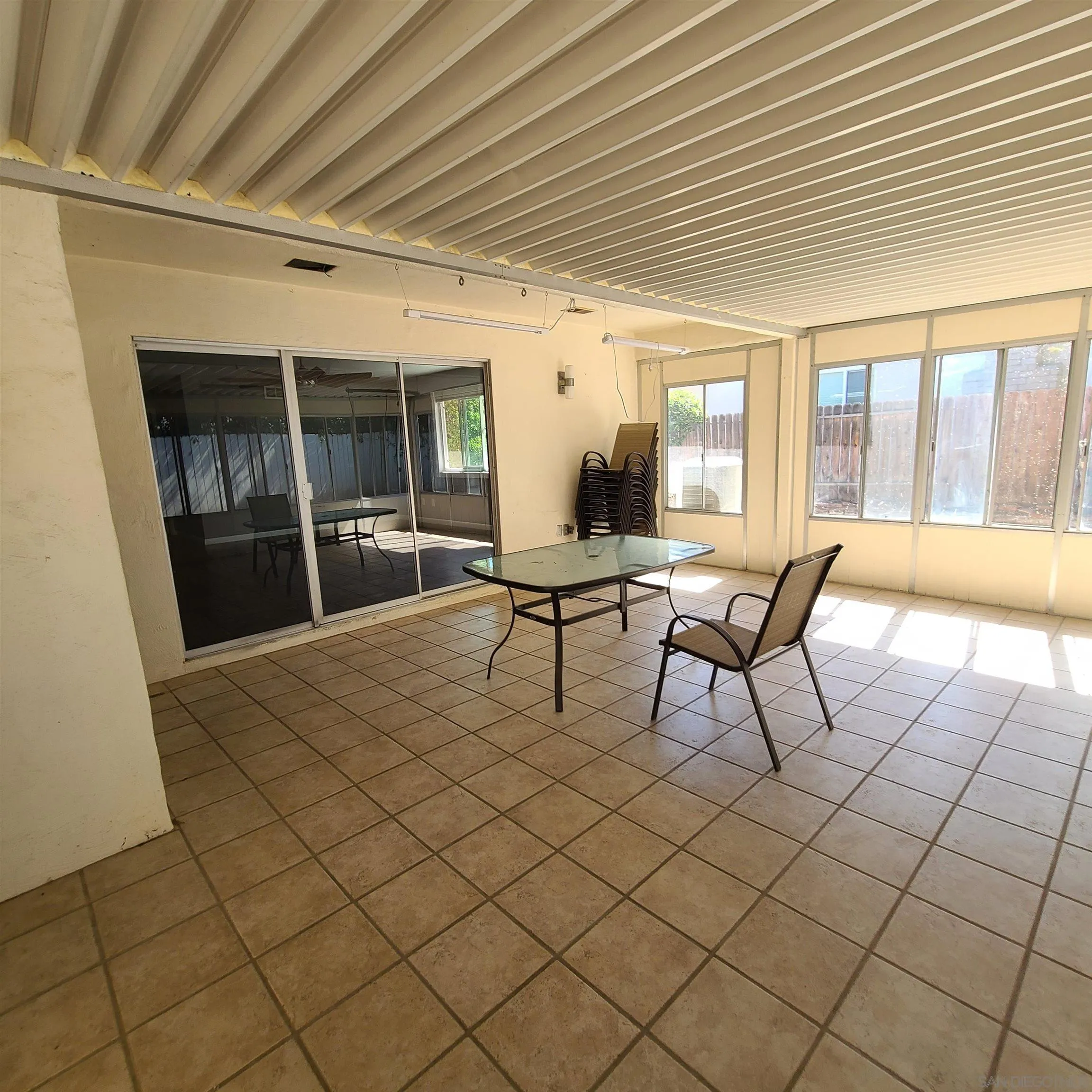 12731 Rios Road San Diego, CA 92128 - Photo 24 of 46 a view of a patio with table and chairs and potted plants