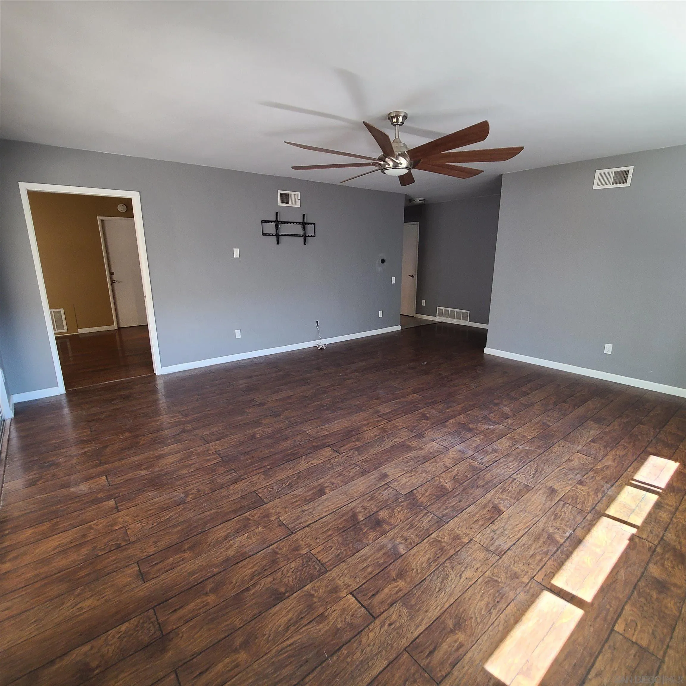 12731 Rios Road San Diego, CA 92128 - Photo 27 of 46 a view of a livingroom with wooden floor