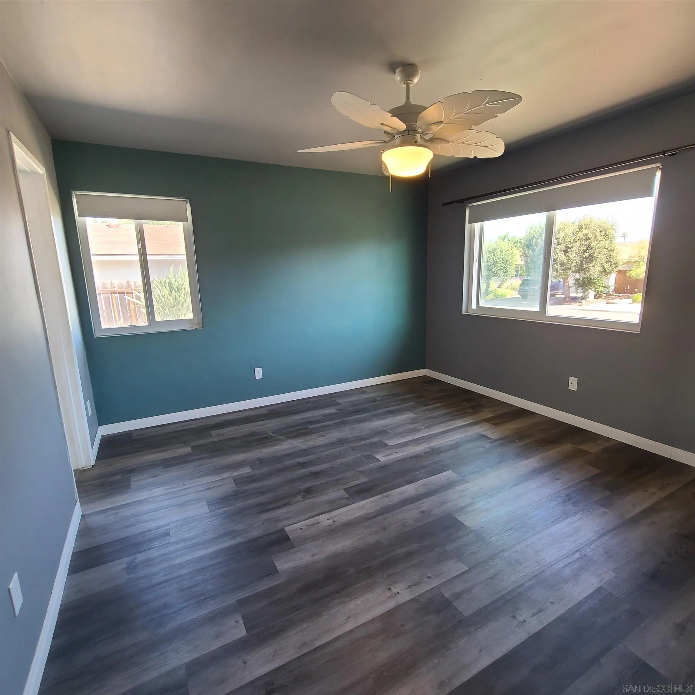 12731 Rios Road San Diego, CA 92128 - Photo 34 of 46 a view of room with window and wooden floor