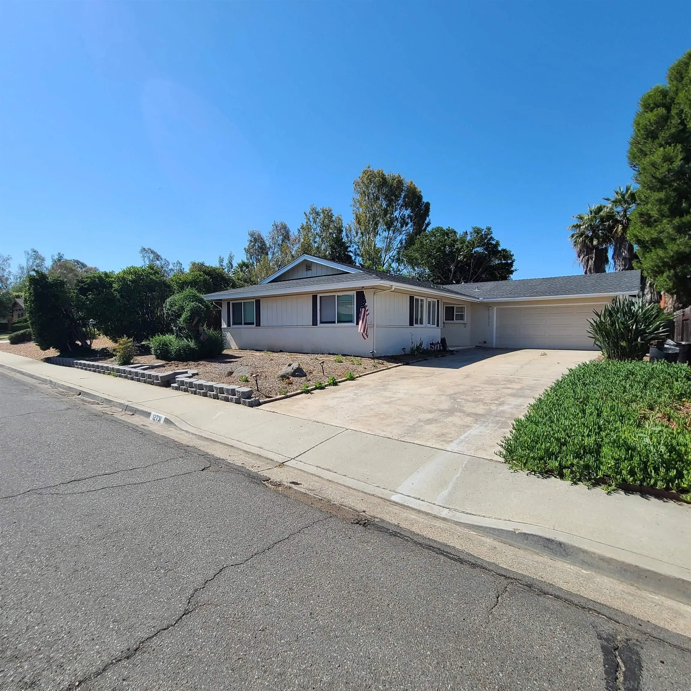 12731 Rios Road San Diego, CA 92128 - Photo 5 of 46 a view of a house with a street