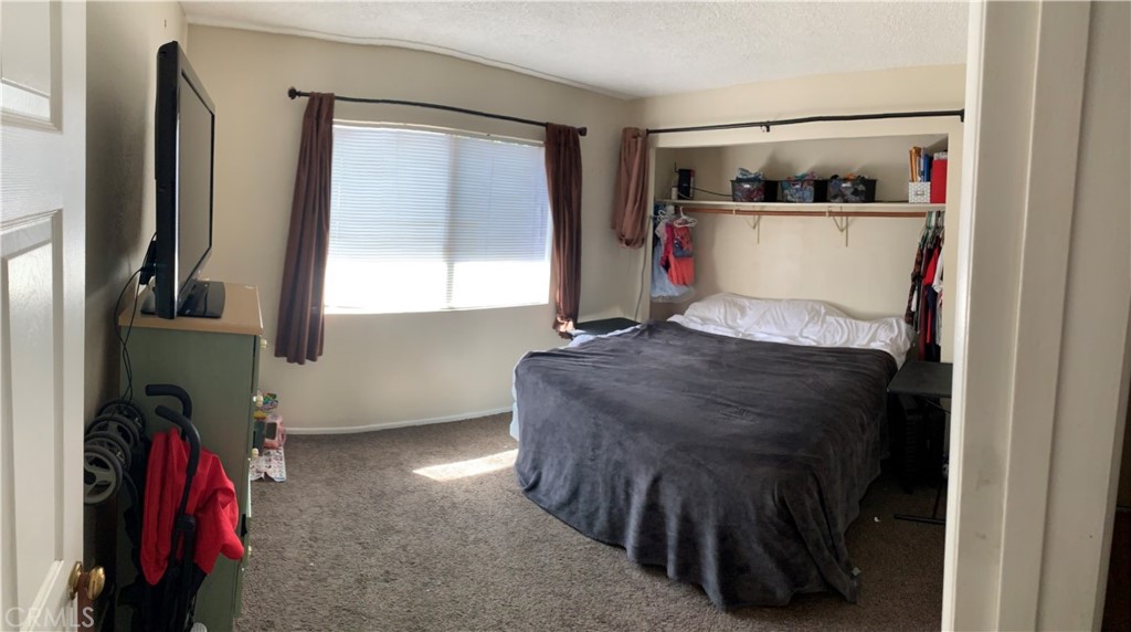 41870 B Street Murrieta, CA 92562 - Photo 11 of 16 a bed room with a bed and a window