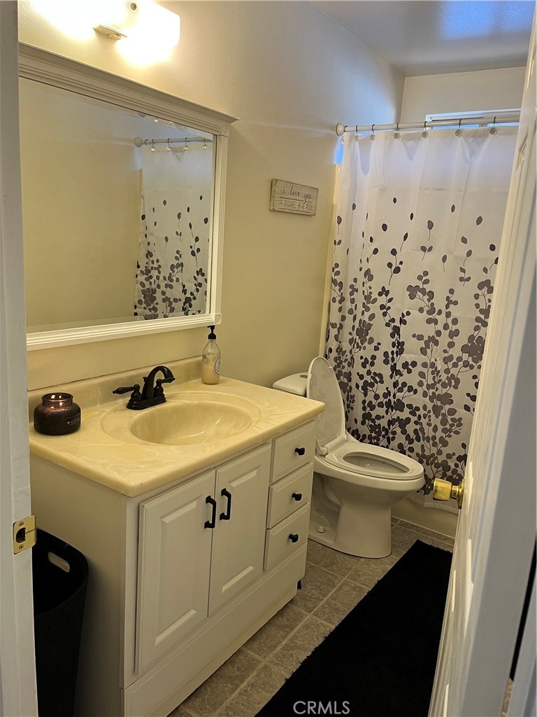 41870 B Street Murrieta, CA 92562 - Photo 12 of 16 a bathroom with a sink and a mirror