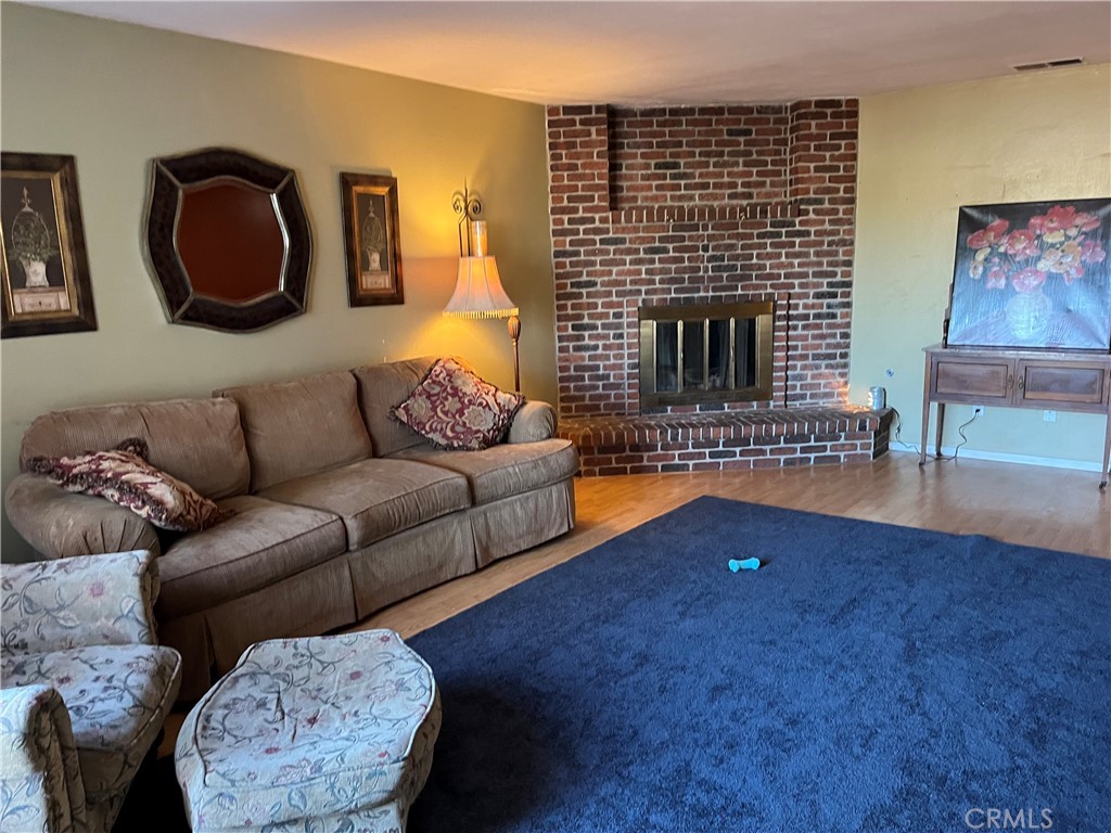 41870 B Street Murrieta, CA 92562 - Photo 5 of 16 a living room with furniture and a fireplace