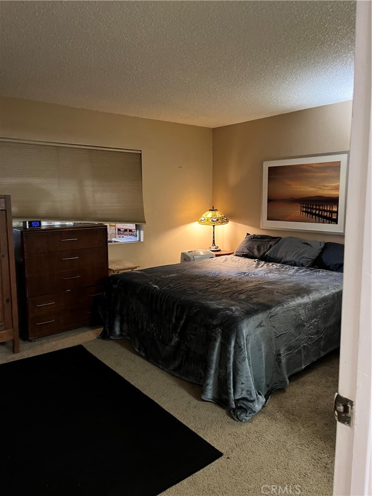 41870 B Street Murrieta, CA 92562 - Photo 9 of 16 a bedroom with a bed and a night stand