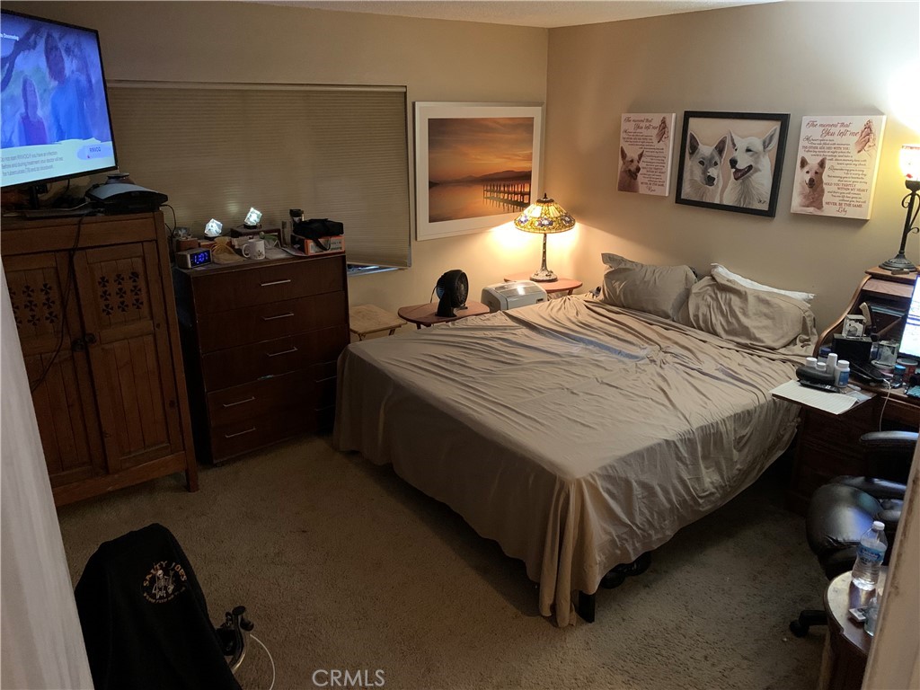 41870 B Street Murrieta, CA 92562 - Photo 10 of 16 a bed room with a bed and a lamp