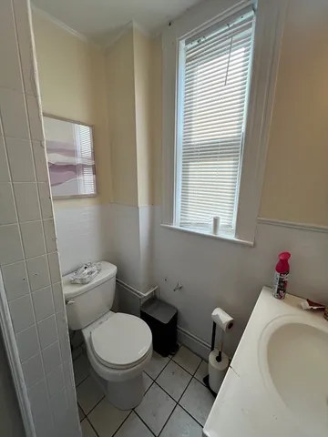 a bathroom with a toilet and a sink