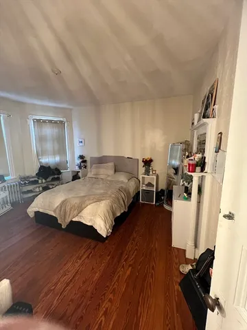 a bed room with bed and a window