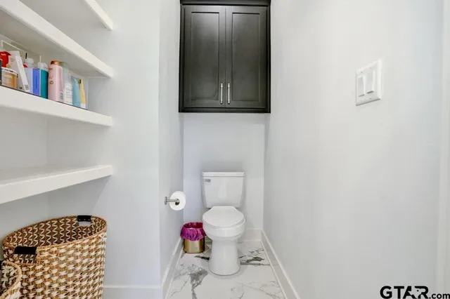 a room with lots of different colored cloths