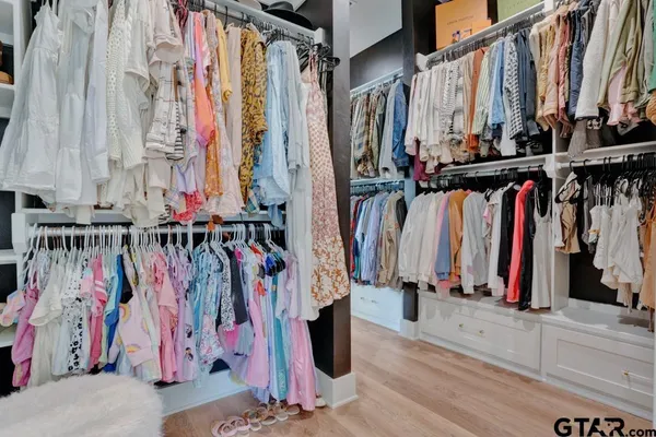 a bathroom with a window and a shower
