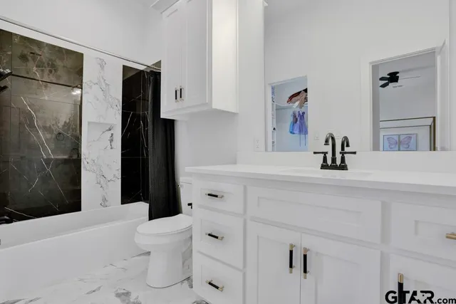 a view of an empty room with glass door and a window