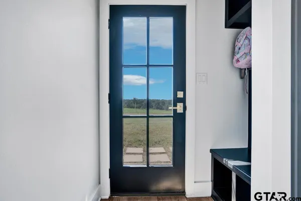 an empty room with wooden floor