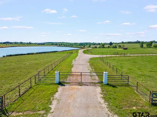 a view of a lake with a garden